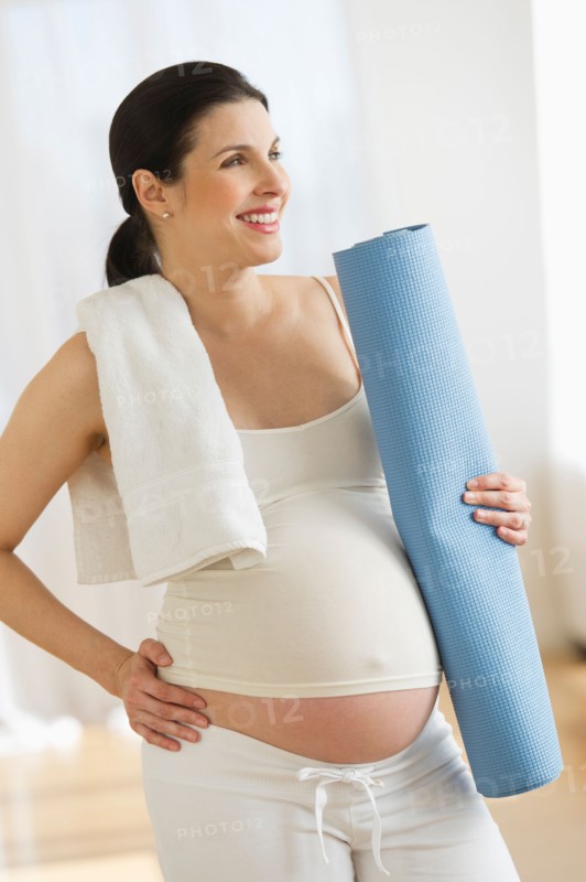 Portrait of pregnant woman exercising.