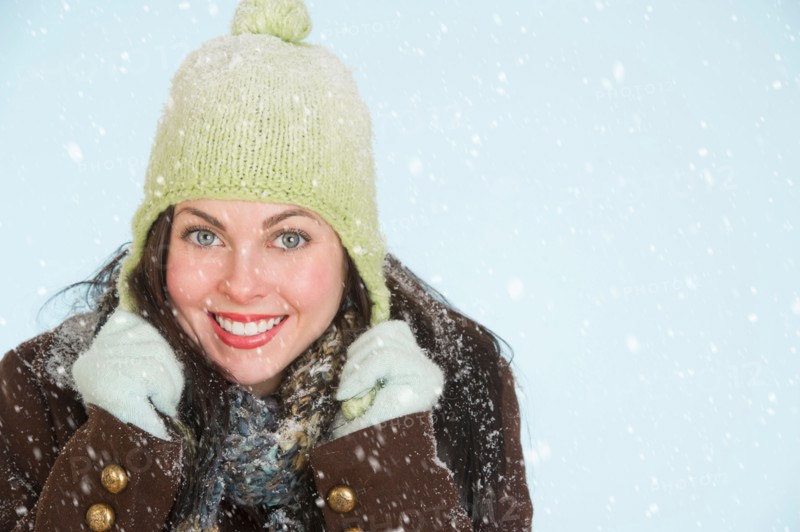 Studio portrait of woman in winter clothing.