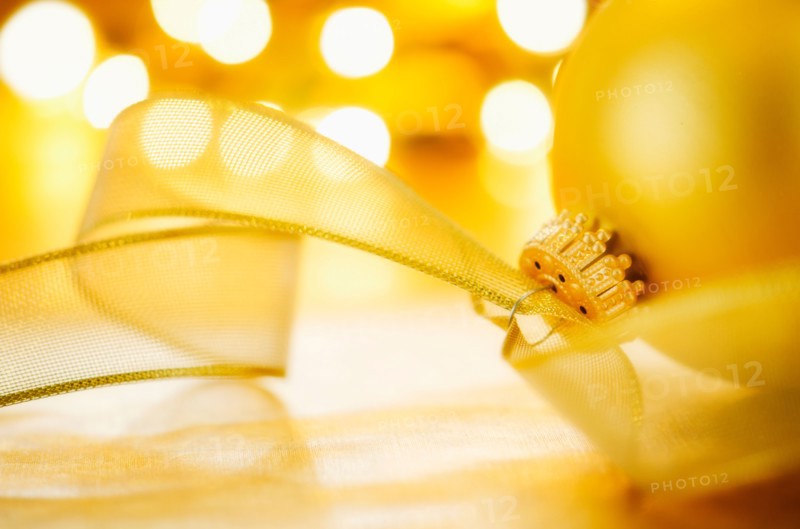 Close-up of Christmas ball with ribbon, studio shot.