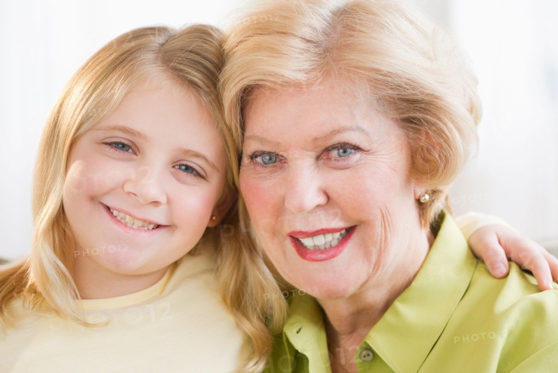 Portrait of grandmother with granddaughter (8-9).