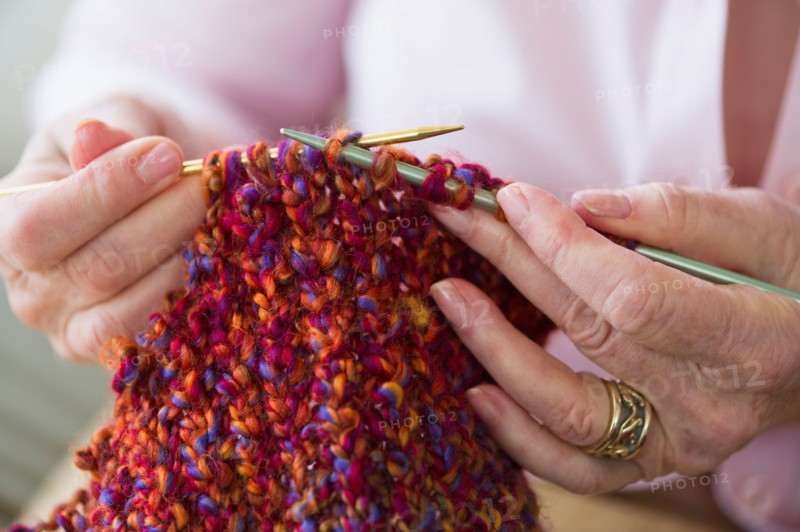 Senior woman knitting, close-up.