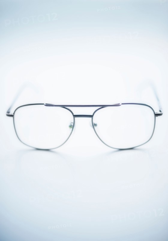 Close up of glasses on blue background, studio shot.