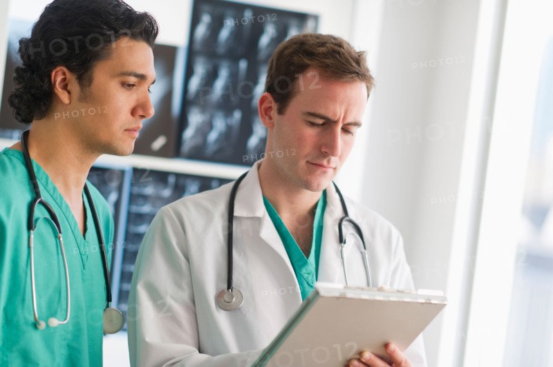 Two male doctors working in hospital.