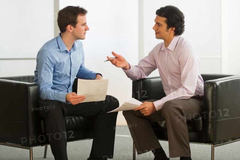 Two businessman talking.