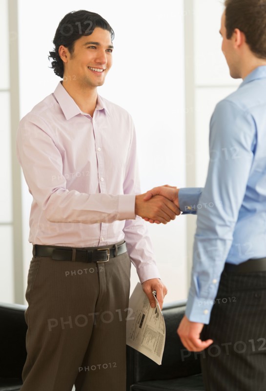 Two businessman shaking hands.
