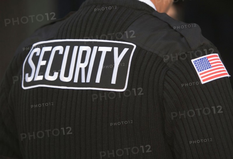 Inscription on man's uniform. Photo : fotog