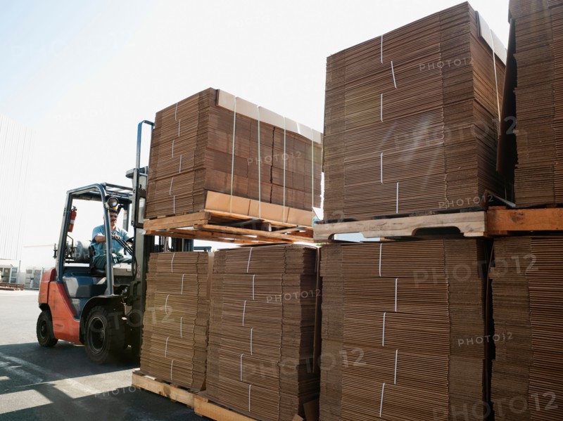 Forklift truck moving pallets.