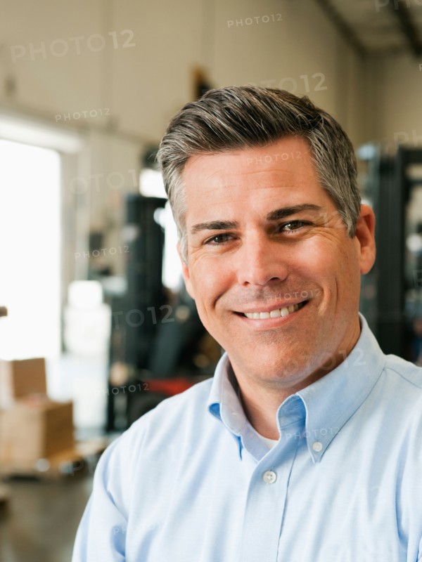 Portrait of businessman in warehouse.
