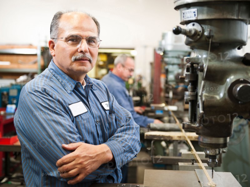 Portrait of skilled worker in factory.
