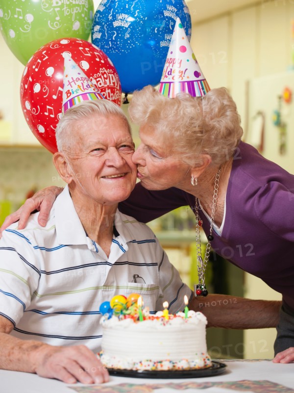 Senior couple celebrating birthday.