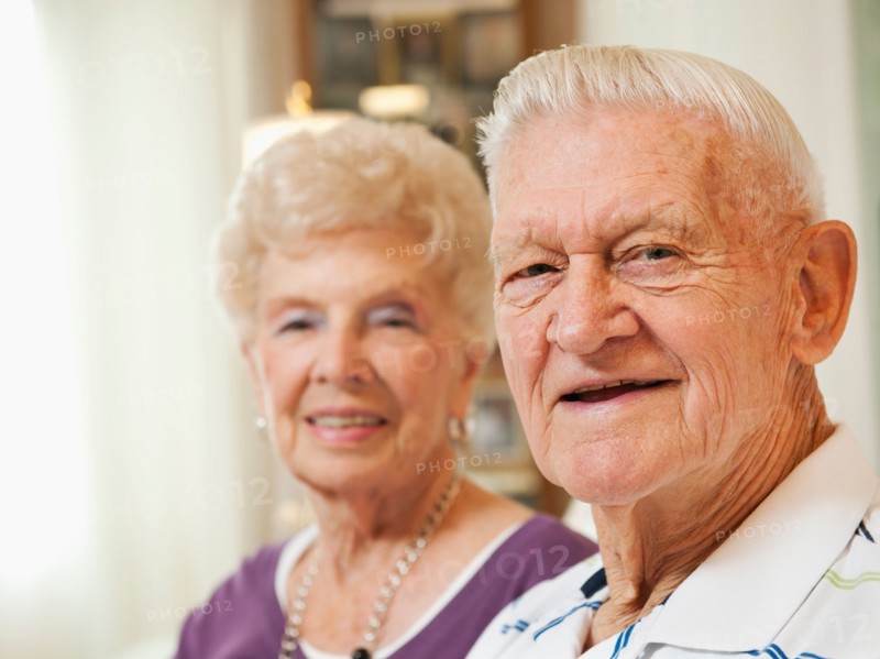 Portrait of senior couple smiling.