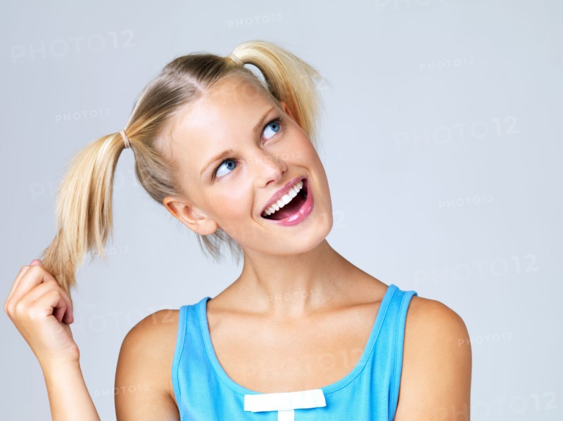 Studio portrait of young woman. Photo : Yuri Arcurs