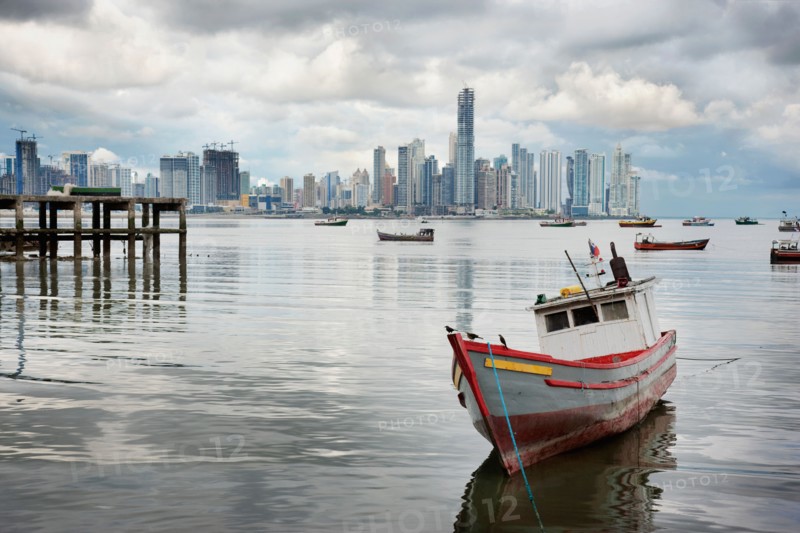 Panama, Panama City, Fishing boat with skyline in background. Photo : DreamPictures