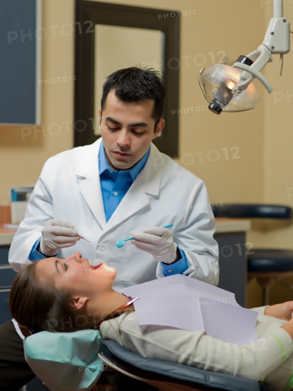 Dentist and patient in dental surgery. Photo : Dan Bannister