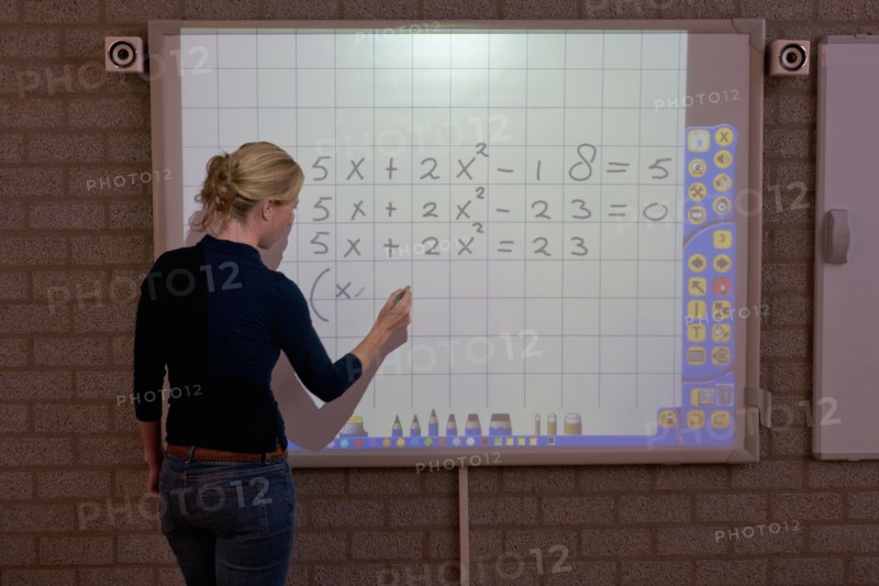 Teacher giving instructions at digital board. Photo : Mark de Leeuw