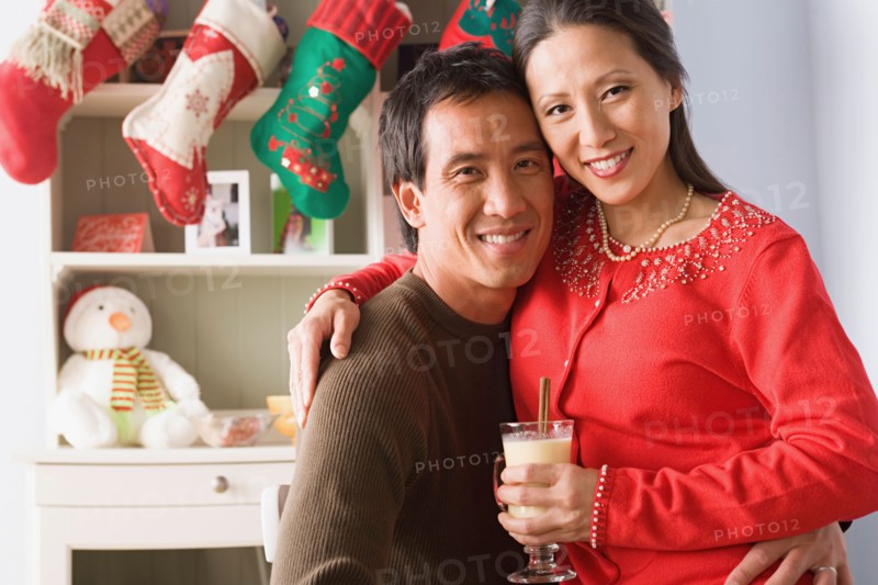 Portrait of couple enjoying christmas time. Photo : Rob Lewine