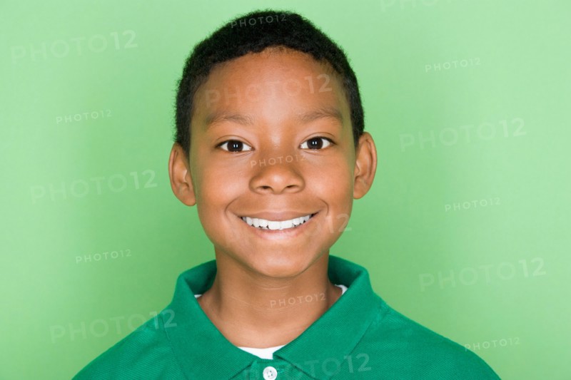Studio shot portrait of young man in polo shirt, head and shoulders. Photo : Rob Lewine