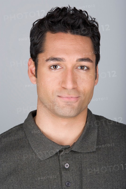 Studio shot portrait of mid adult man, head and shoulders. Photo : Rob Lewine