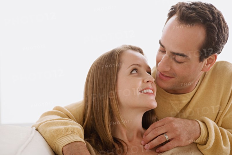 Married couple in close embrace looking at each other. Photo : Rob Lewine