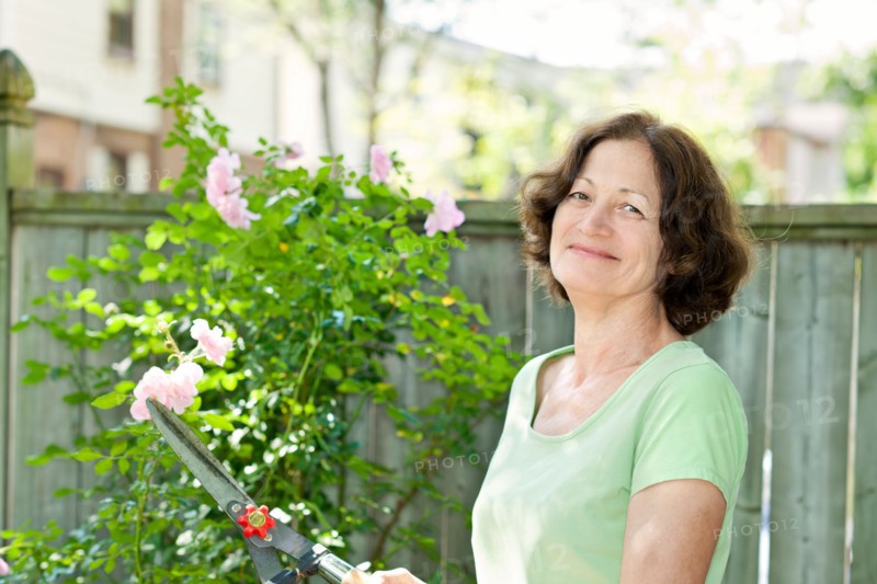 Woman working in garden. Photo : Elena Elisseeva