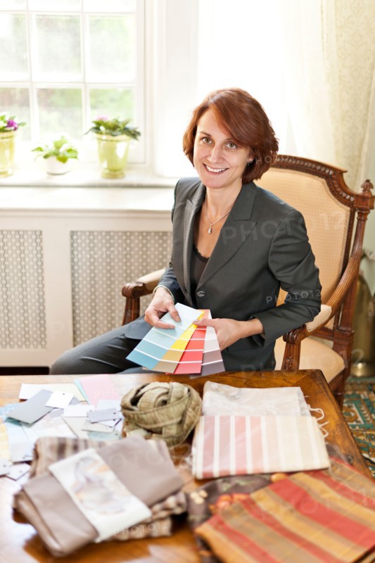 Woman checking color samples. Photo : Elena Elisseeva