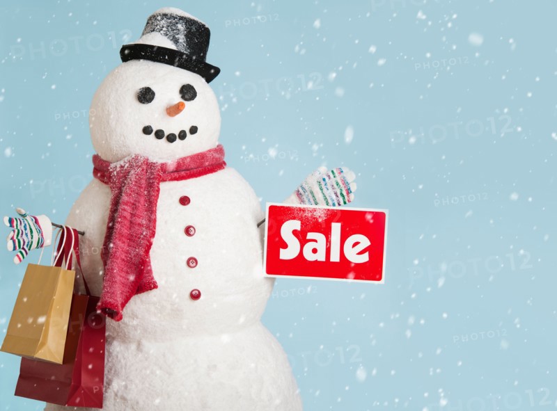 Studio shot of snowman with shoppings.