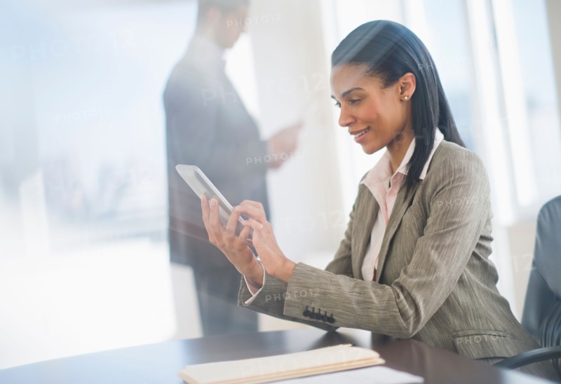 Business woman using tablet pc.