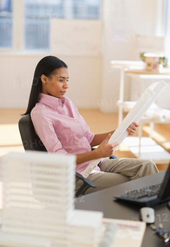 Female architect in office.
