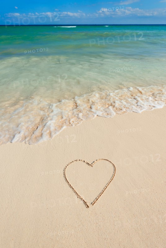 Mexico, Yucatan. Heart drawing in sand on beach.