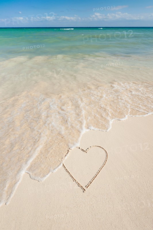 Mexico, Yucatan. Heart drawing in sand on beach.