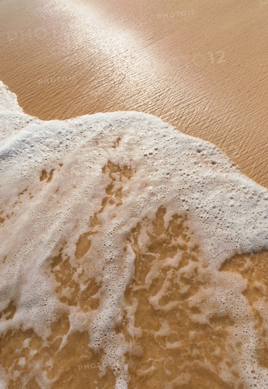 Mexico, Yucatan. Sea waves on beach sand.