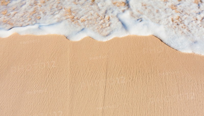 Mexico, Yucatan. Sea waves on beach sand.