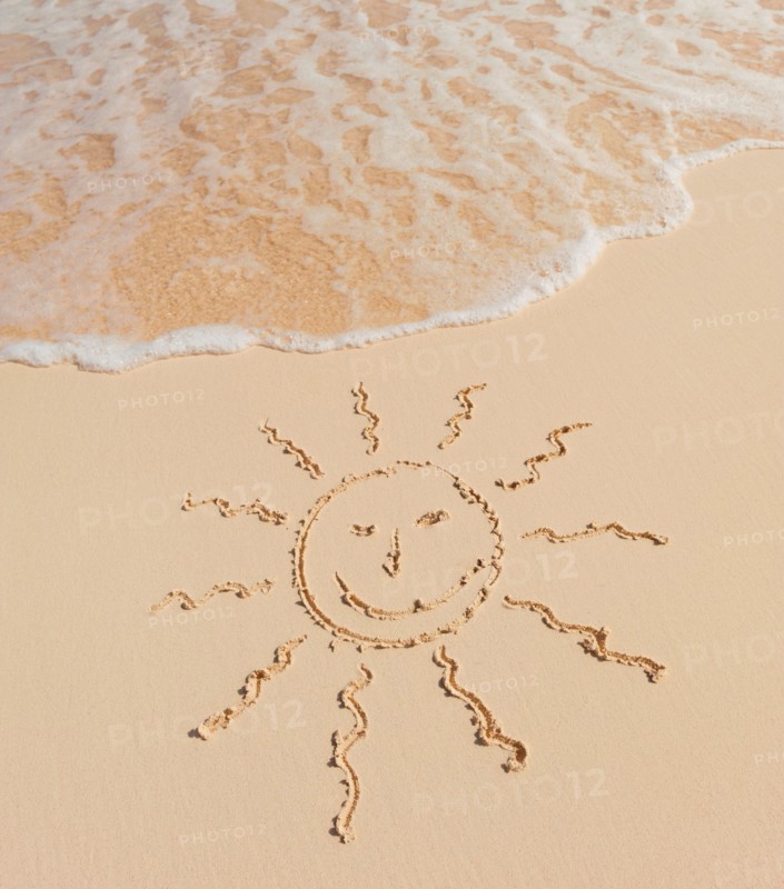 Mexico, Yucatan. Sun drawing on beach.