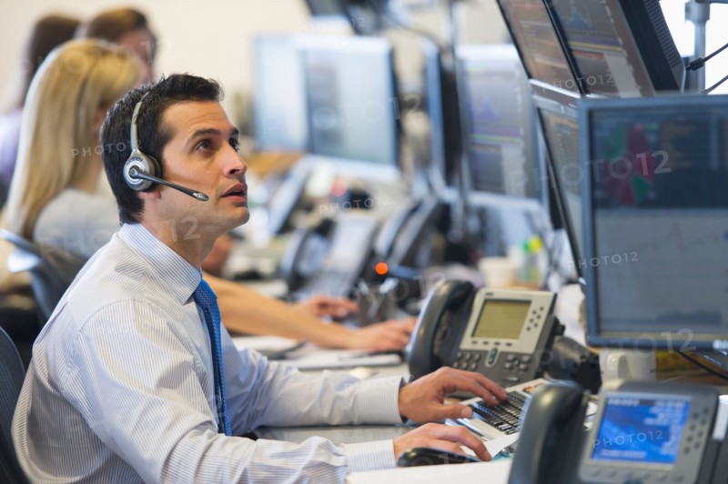 Traders at trading desk.