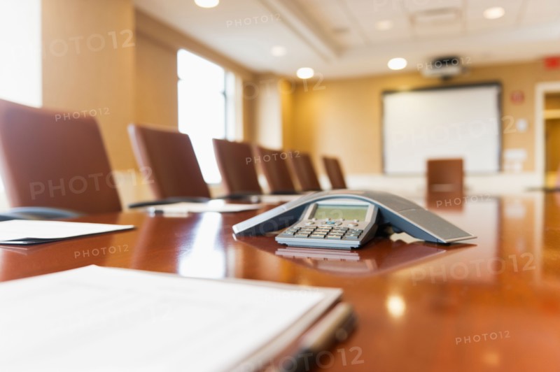 Conference phone on conference table.