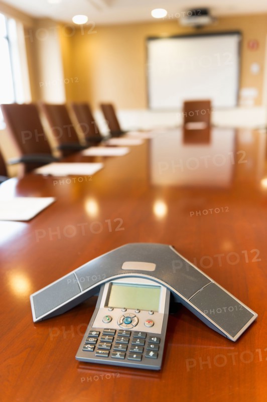 Conference phone on conference table.