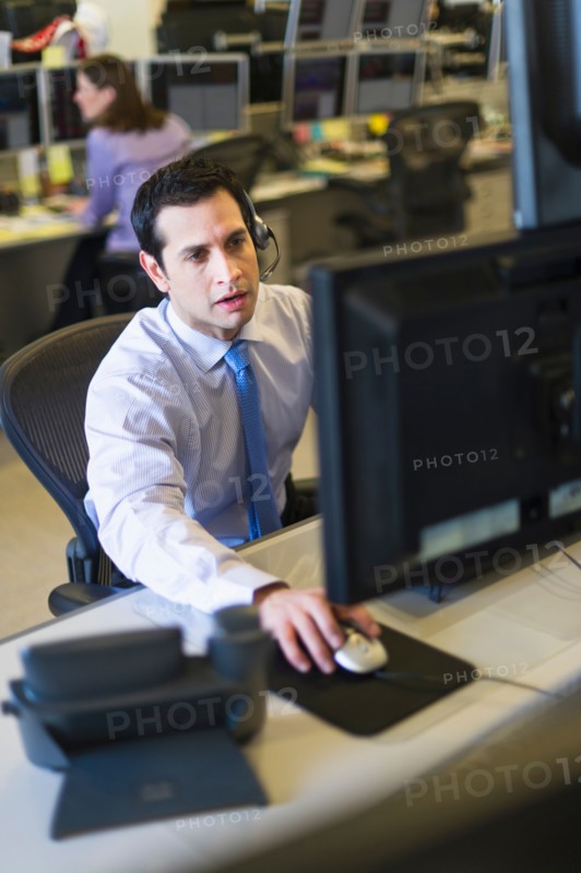 Traders at trading desk.