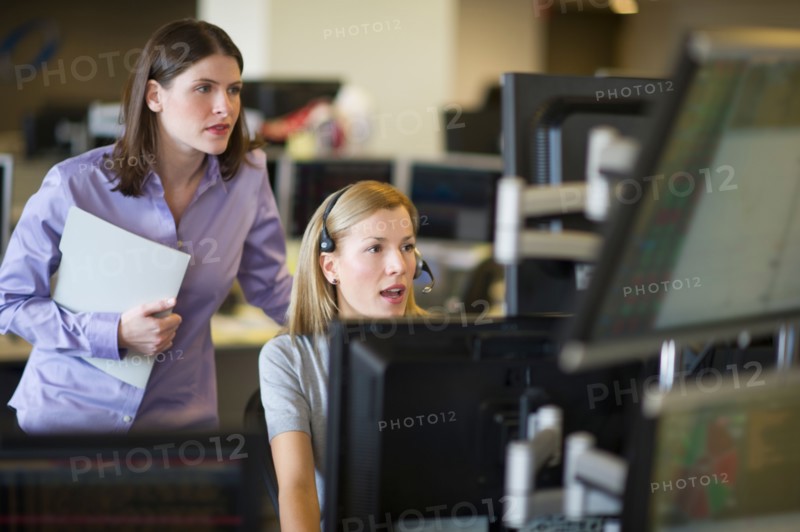 Traders at trading desk.