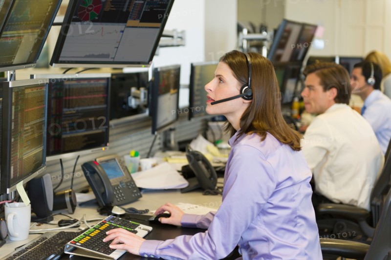 Traders at trading desk.