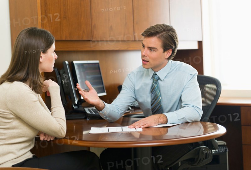 Businessman and client talking in office.