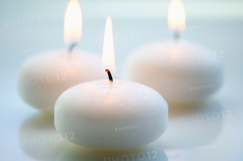 Close-up of white candles.
