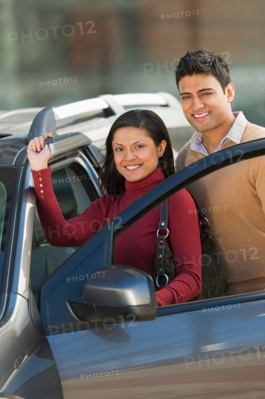 Couple with new car.