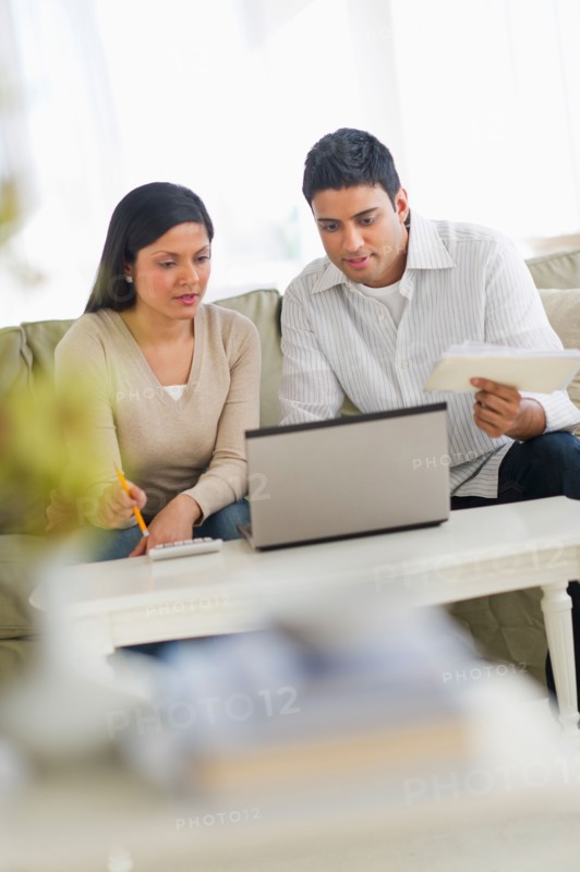 Couple using laptop.