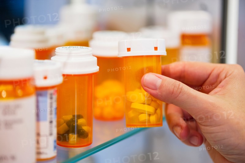 Pill bottles on shelf.