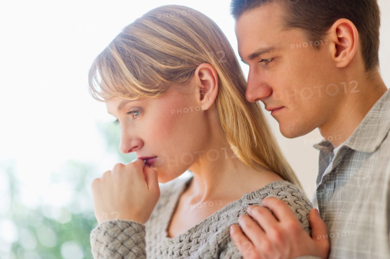 Portrait of sad couple.