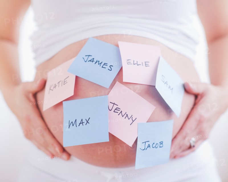 Pregnant woman with labels on her belly. Photo : Daniel Grill