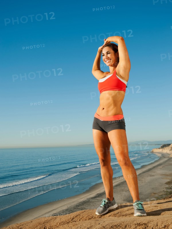 USA, California, San Diego. Woman training on coast.