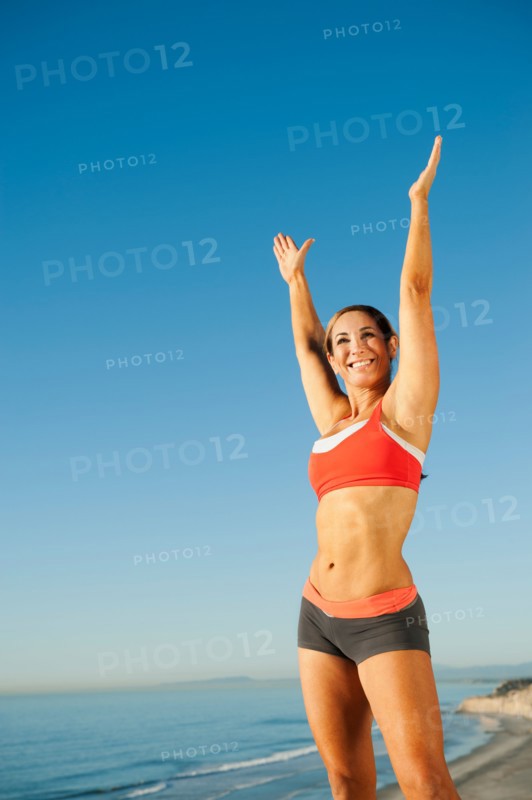USA, California, San Diego. Woman training on coast.