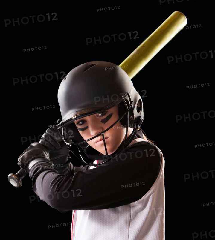 Portrait of girl (12-13) plying softball. Photo : Mike Kemp