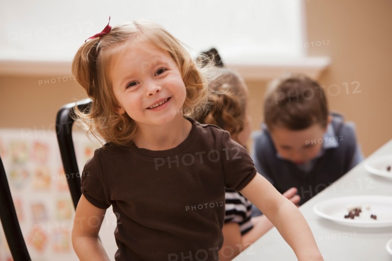 Portrait of girl (2-3) in kindergarten. Photo : Mike Kemp